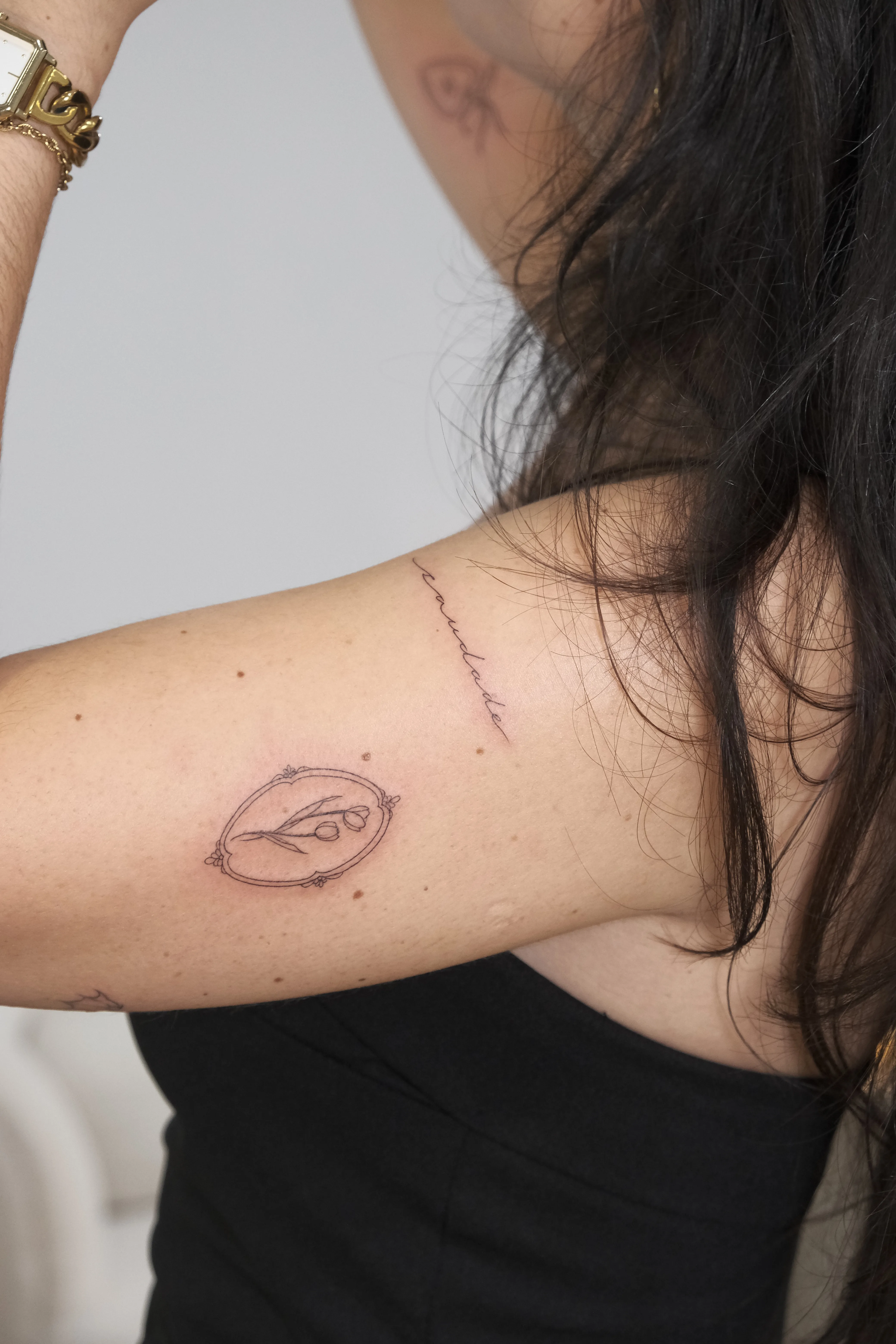 Fine line floral tattoo